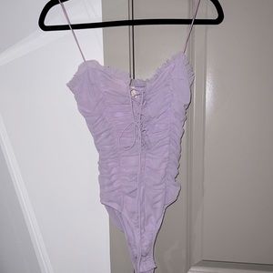 Corset lace up Lilac Bodysuit from Boutique store. Never worn size S.